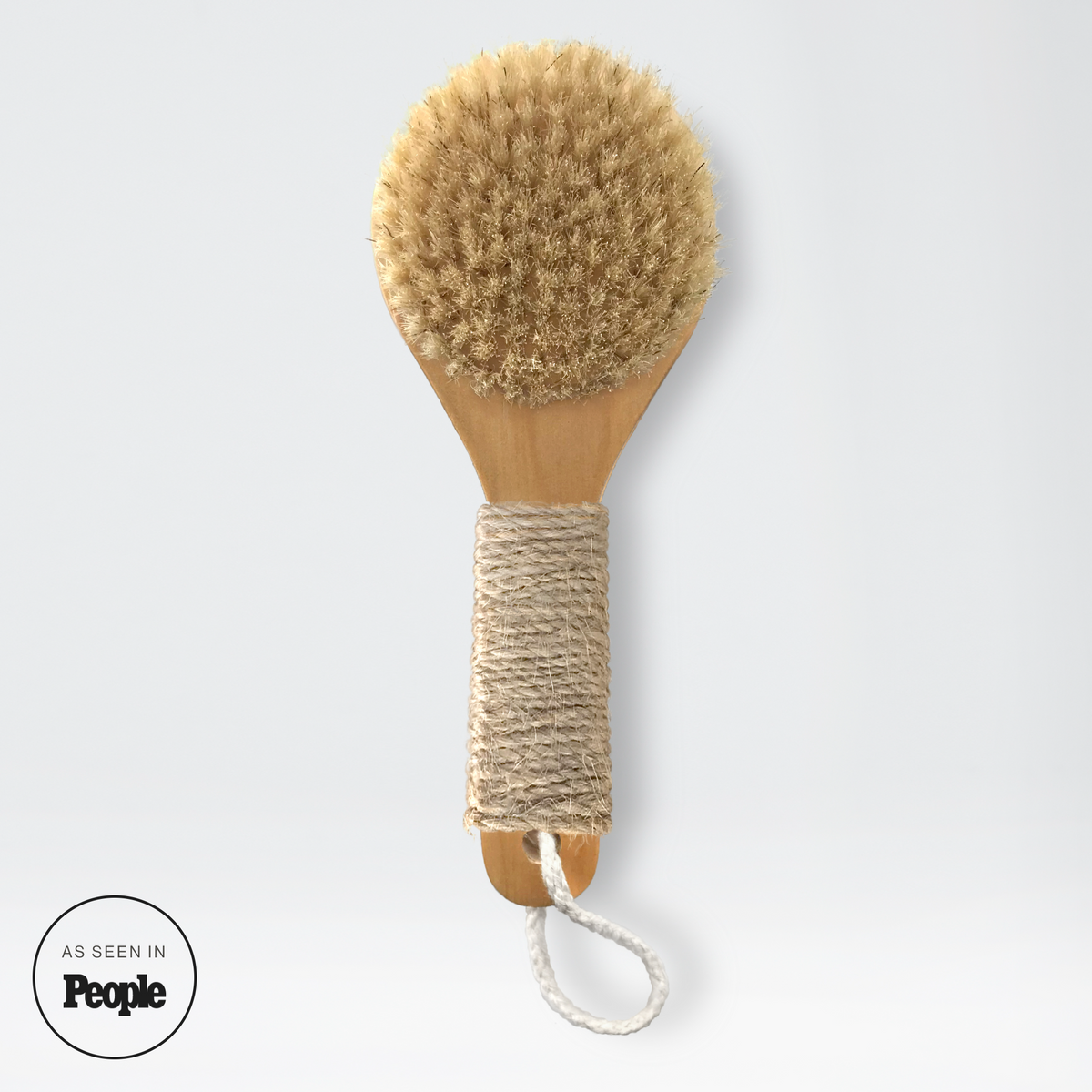 Natural bristle dry brush with round wooden head and hemp twine handle loop