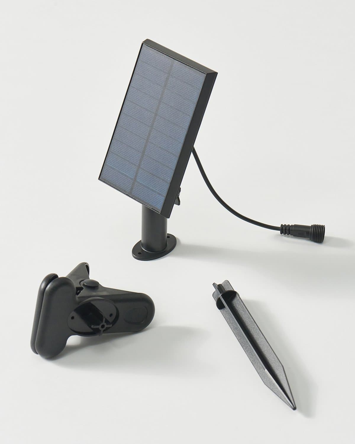 Solar panel string light kit with stake, controller, and black wiring