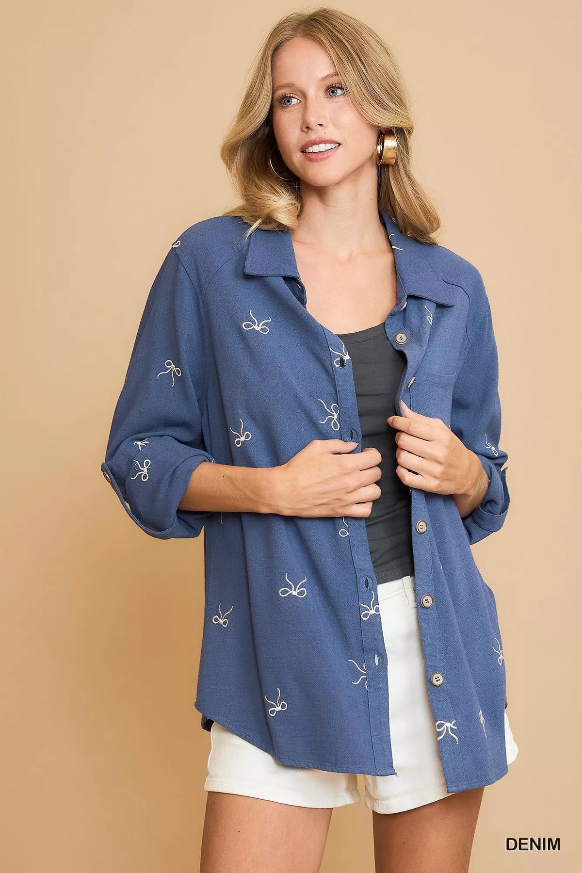Denim blue fitted button-up shirt with ribbon bow embroidery, open collar, long sleeves