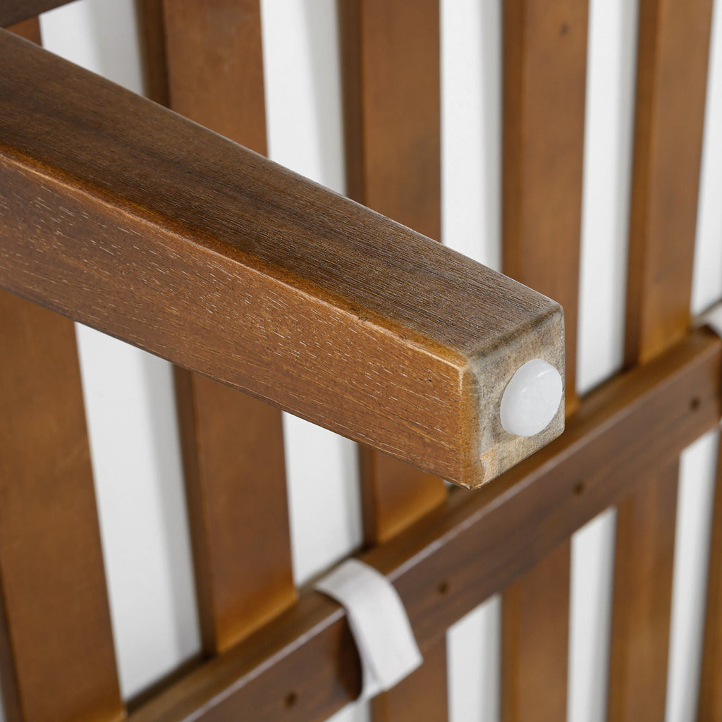 Acacia wood armrest detail with gray rope-textured panel and fabric cushion edge