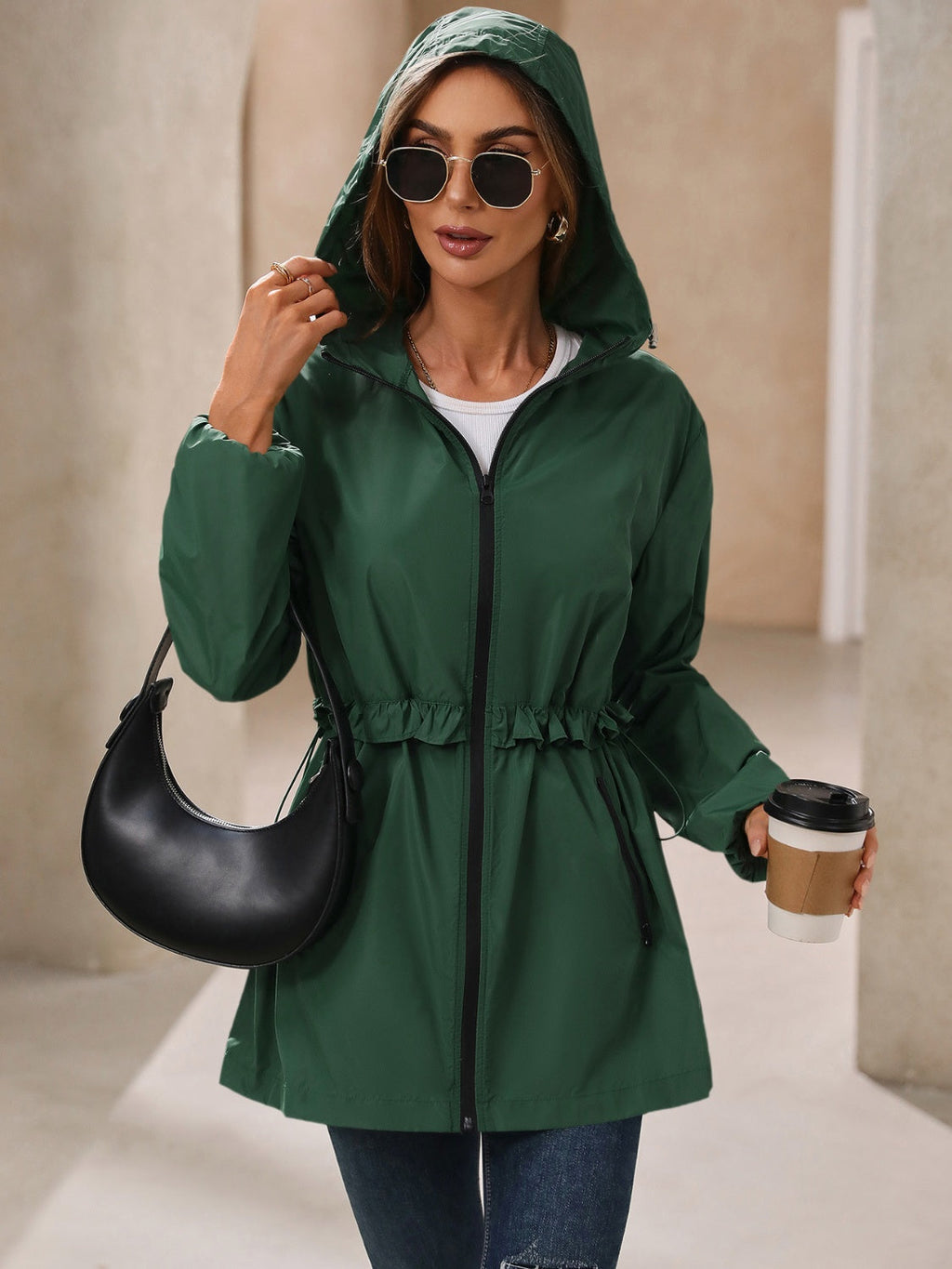Women’s hooded windbreaker jacket, dark green with black zipper and ruffle waist