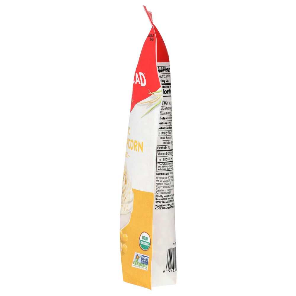 Organic yellow popcorn bag narrow side view with ingredient and label text