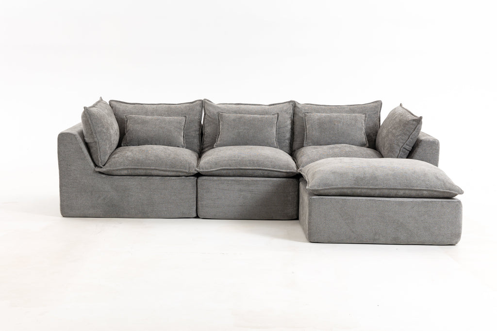 Gray modular sectional sofa with chaise ottoman and tufted-looking seat cushions