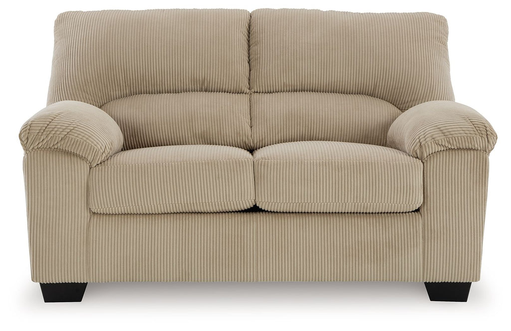 Beige upholstered loveseat with ribbed fabric and two seat cushions