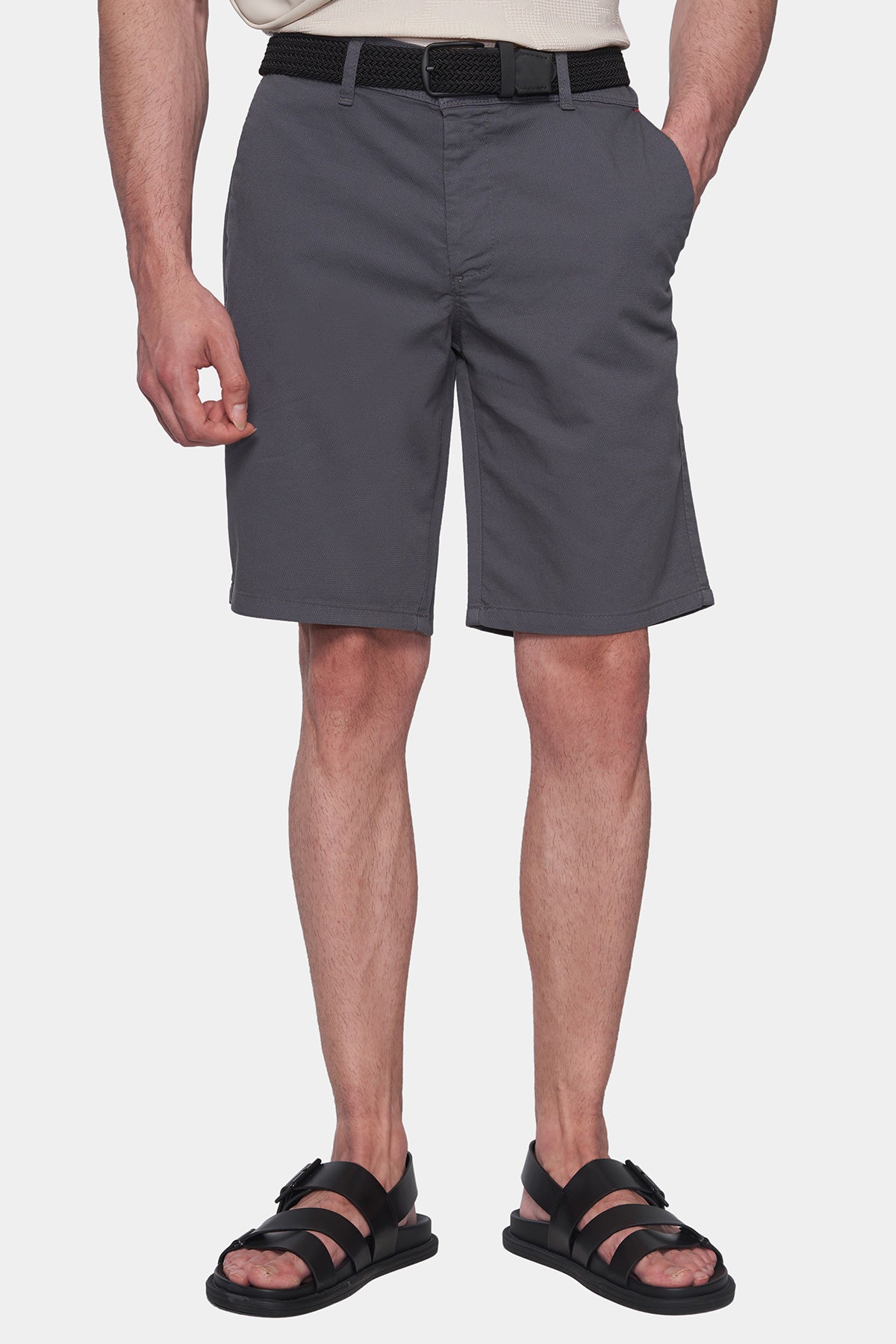 Men's dark grey knee-length shorts with front button closure and pockets