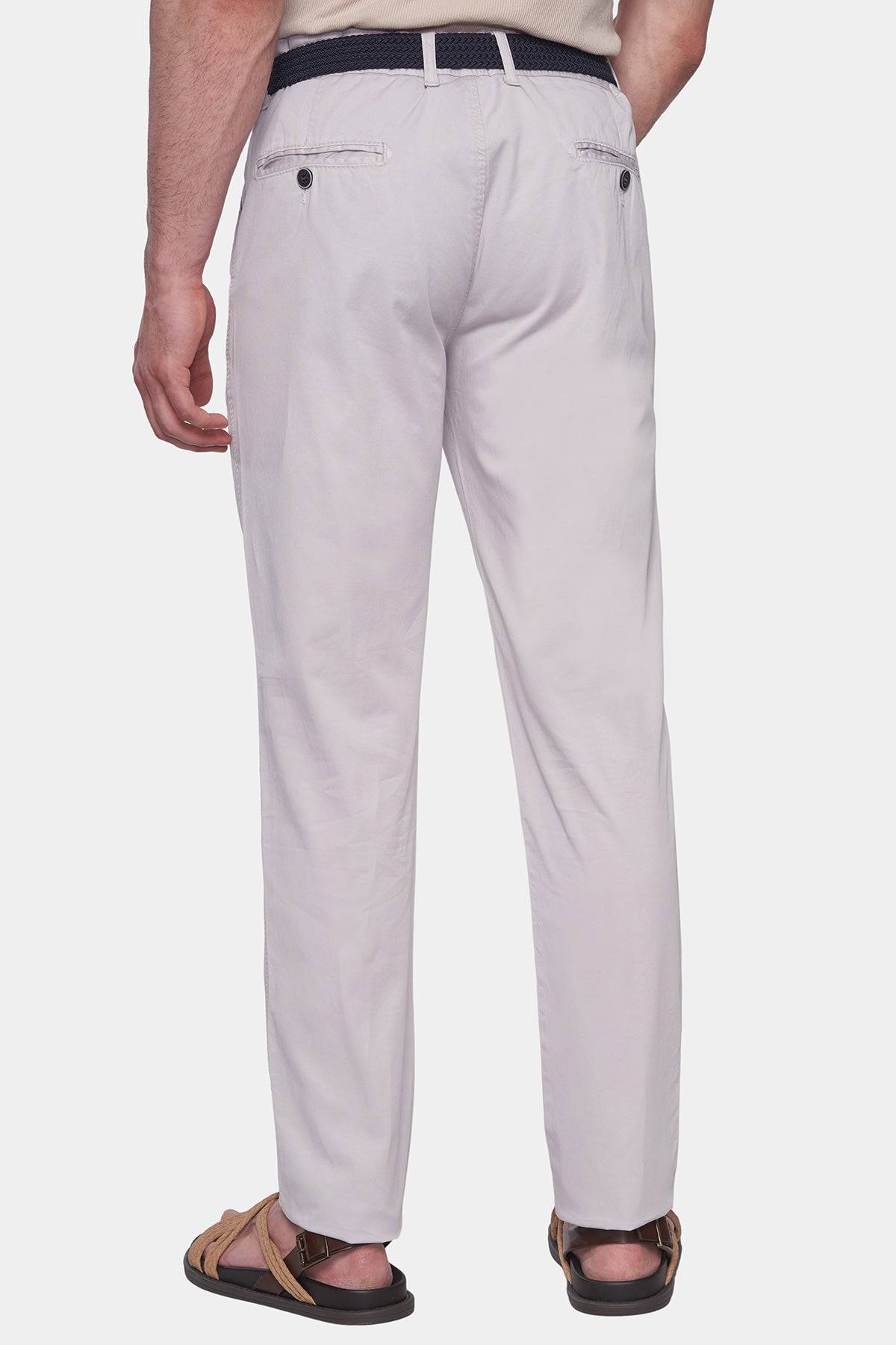 Off-white chino pants with rear welt pockets and button waistband