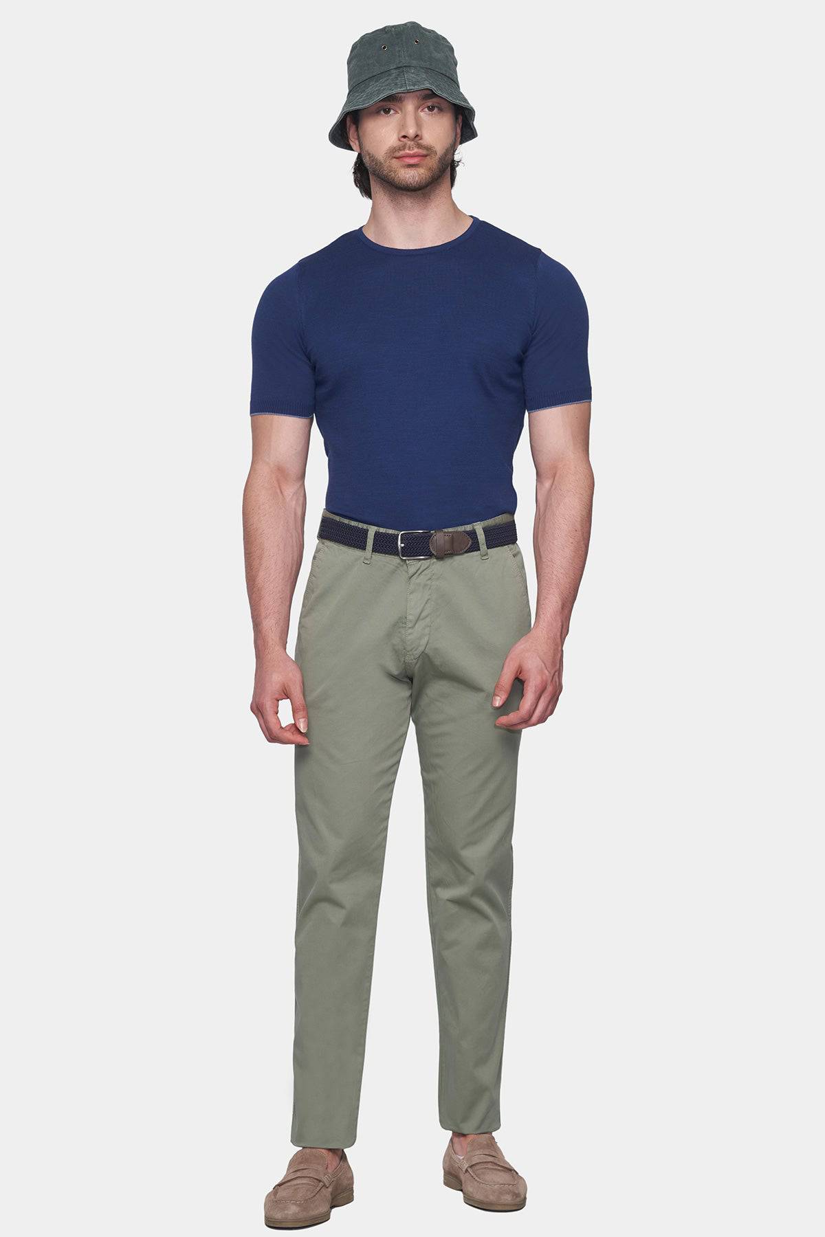 Olive chino pants with straight legs, dark belt, and front pockets