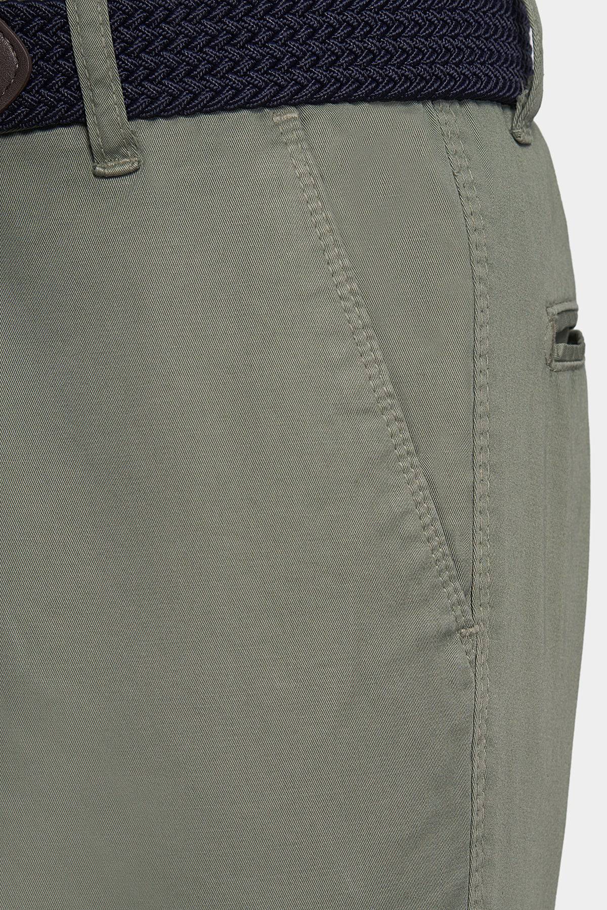 Olive chino waistband and belt loop detail with buttoned front fly