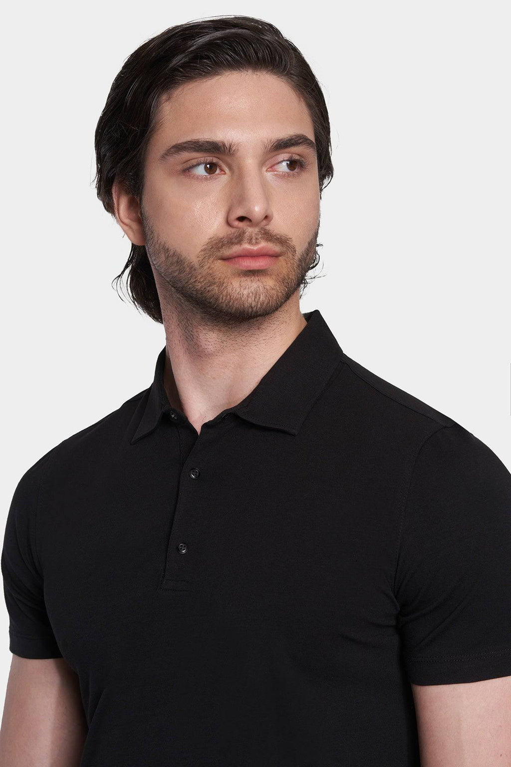 Black polo shirt close-up of collared neckline and button placket