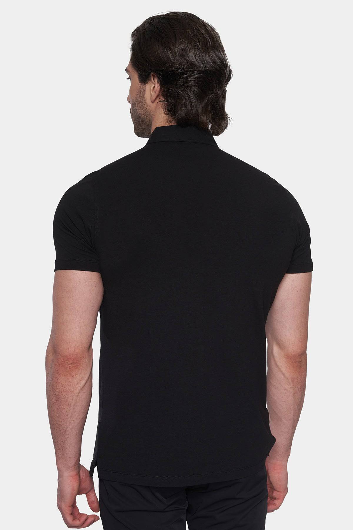 Back view of black polo shirt with short sleeves and curved hem