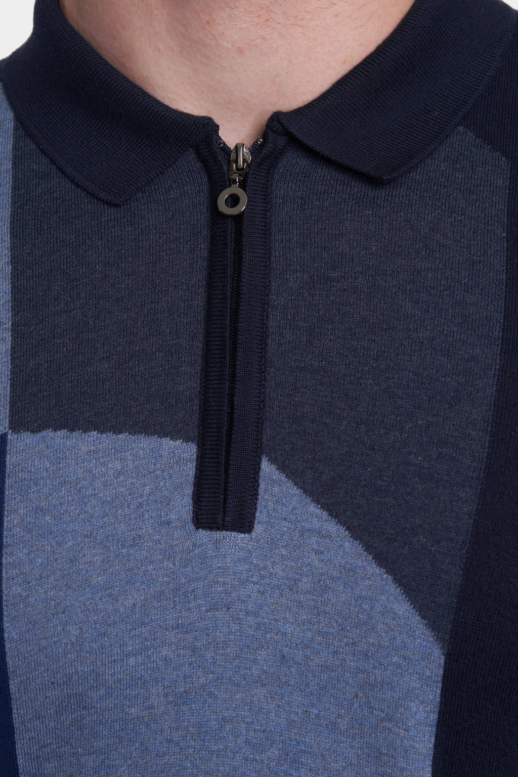 Navy cotton polo with half-zip placket and metal ring pull