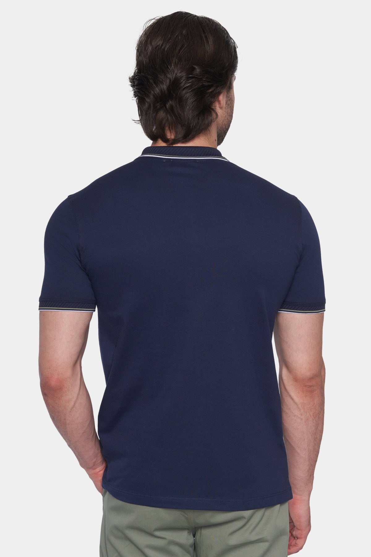 Back view of navy mercerized cotton polo with ribbed collar and short sleeves