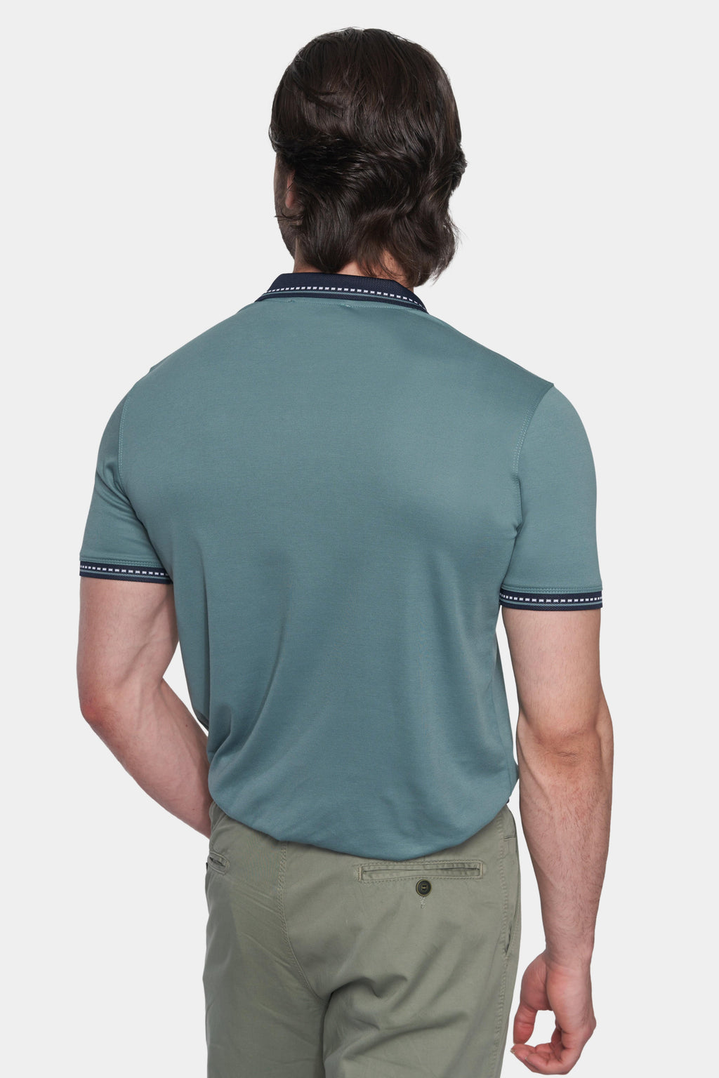 Back view of racing green mercerized cotton open polo with navy cuff trim