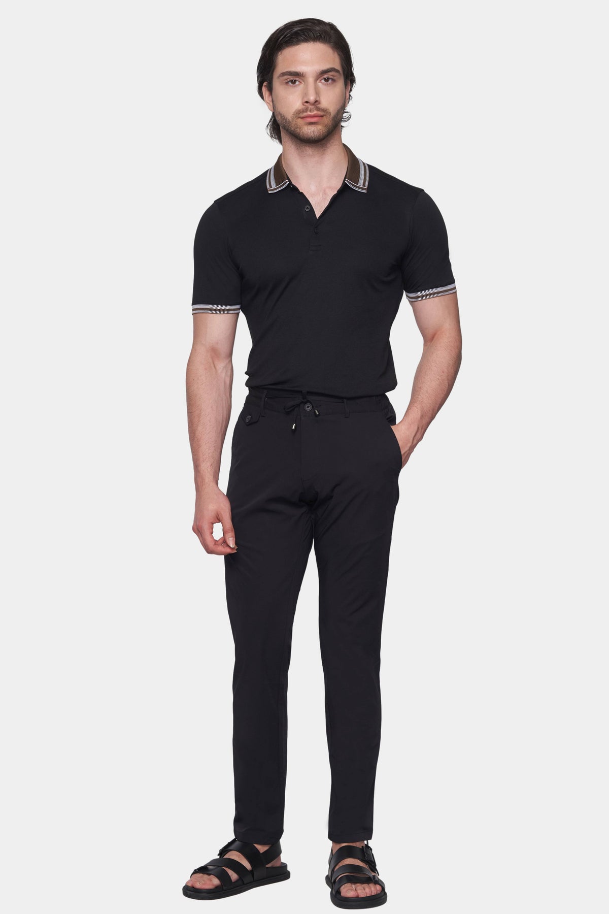 Black polo shirt with brown striped collar, short sleeves, and button placket