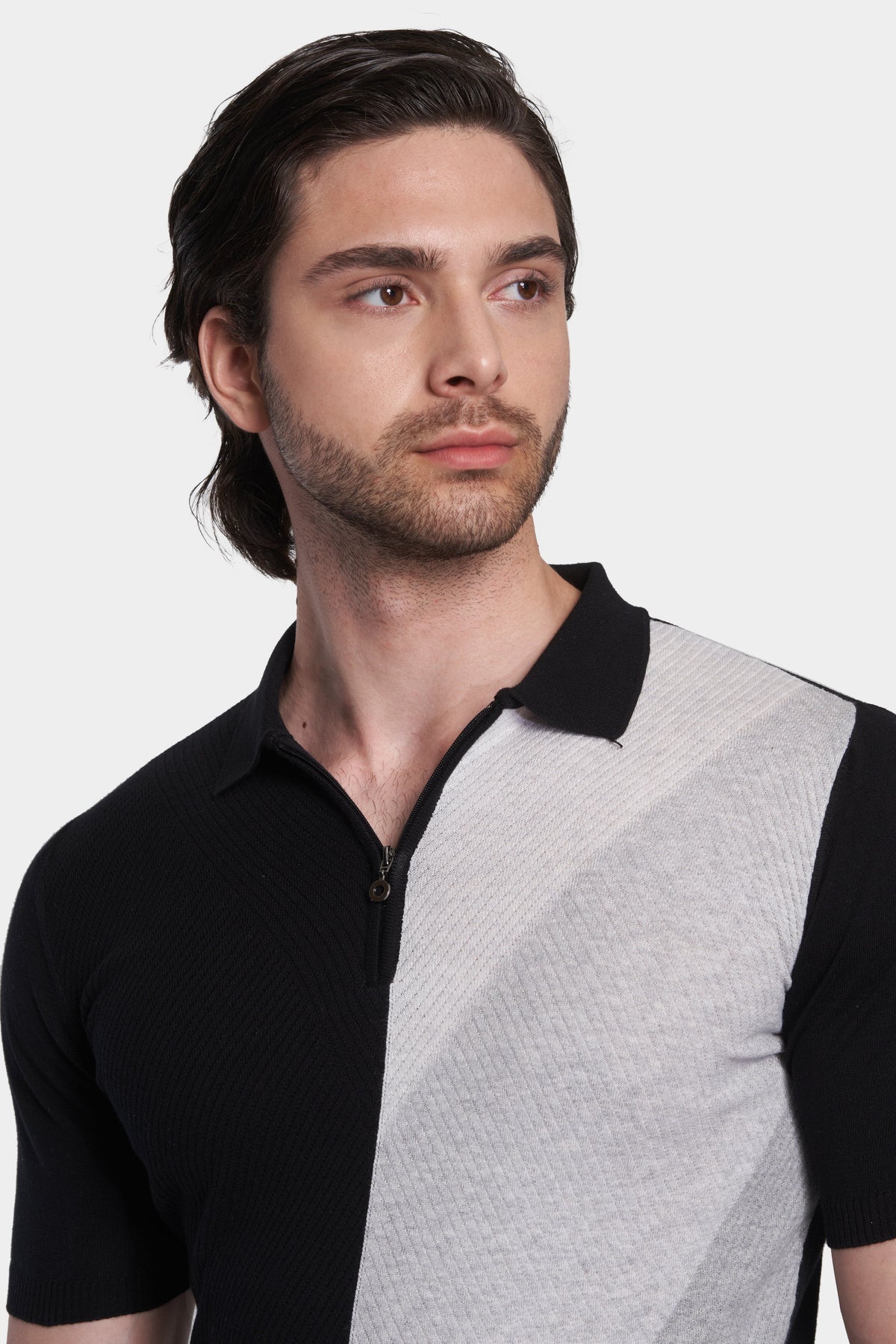 Close-up of black and heather gray knit polo collar with zip front