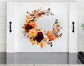 White stove cover with fall floral wreath and black side handles