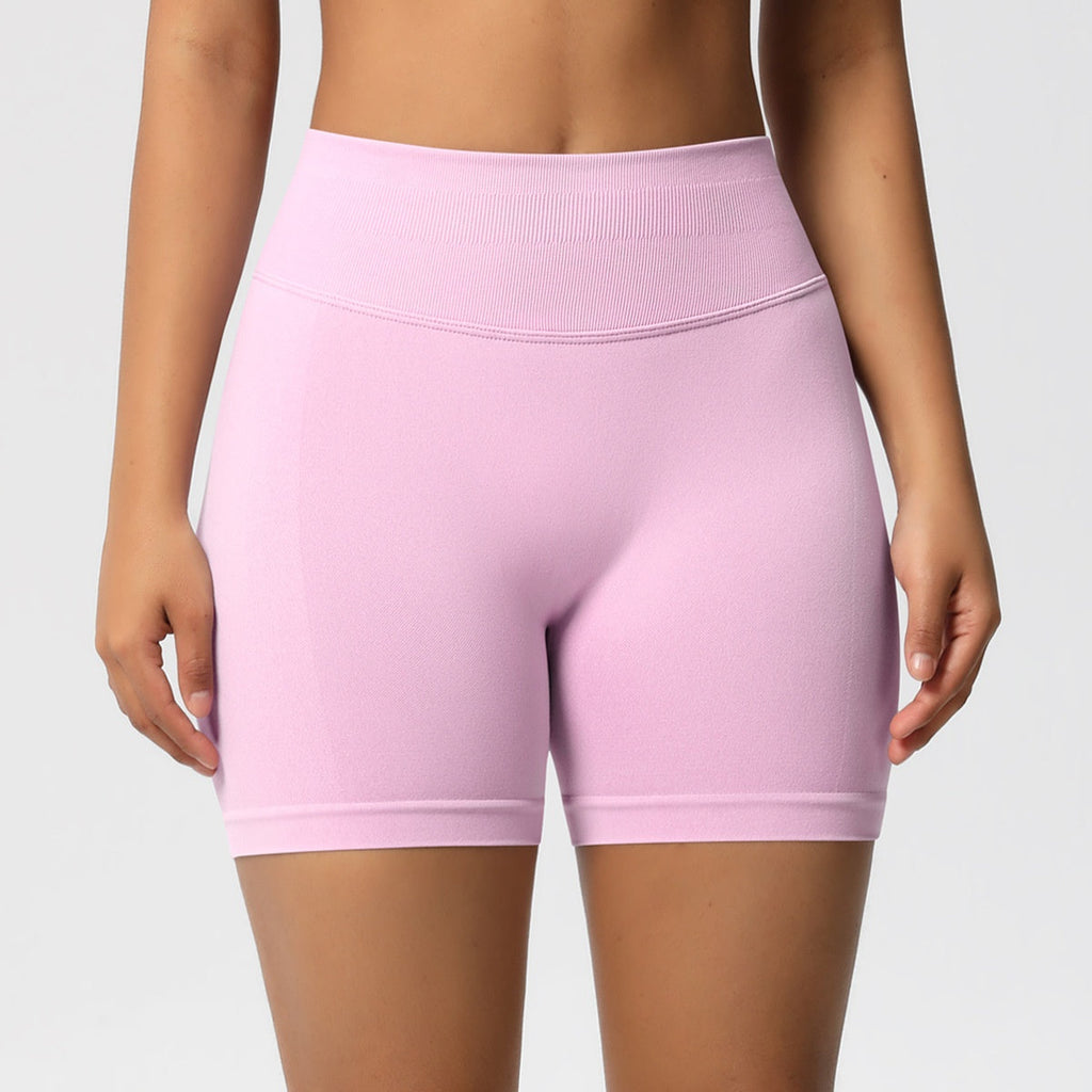 High-waist yoga shorts in light pink, smooth fitted stretch fabric