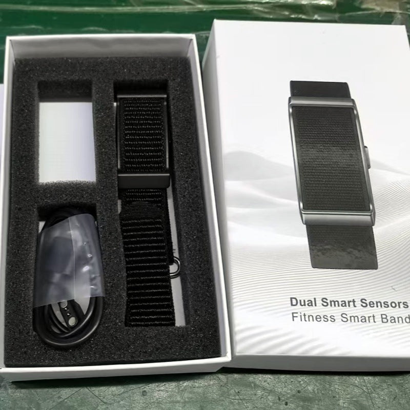 Smart fitness bracelet with black woven strap and metallic sensor module in box