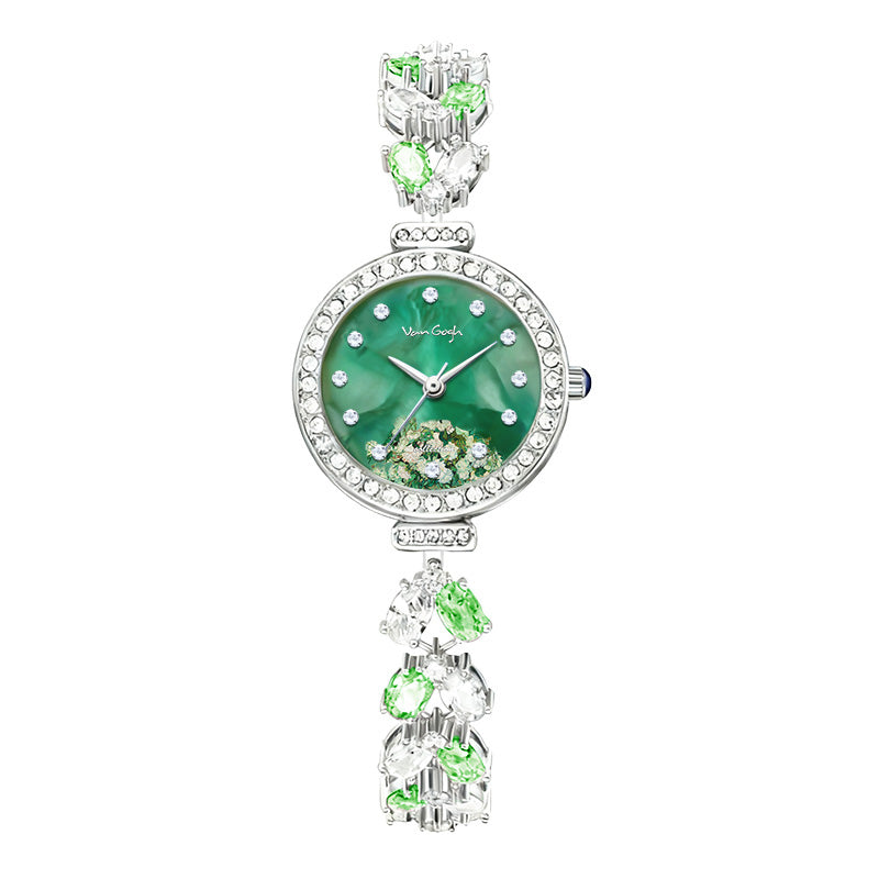 Green floral dial wristwatch with rhinestone bezel and silver charm links