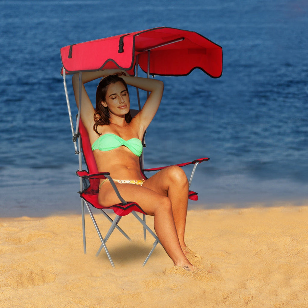 Red folding beach chair with sun canopy and padded seat for outdoor lounging