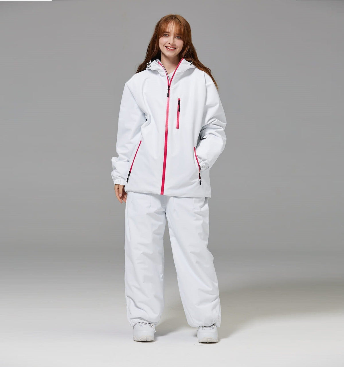 White unisex ski suit set with pink zipper hooded jacket and matching loose pants