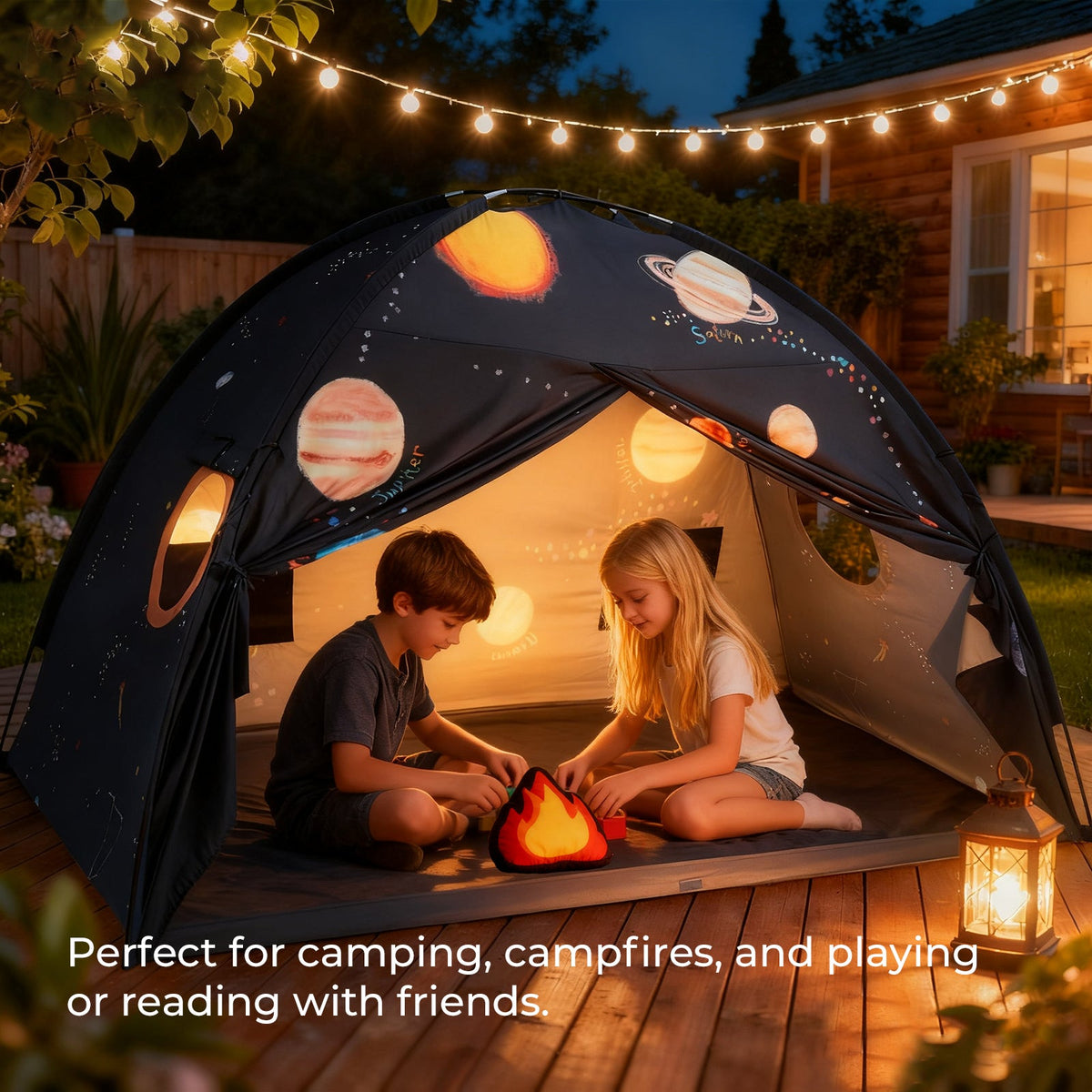 Kids play tent with dark navy space print and warm interior lights for bedtime play