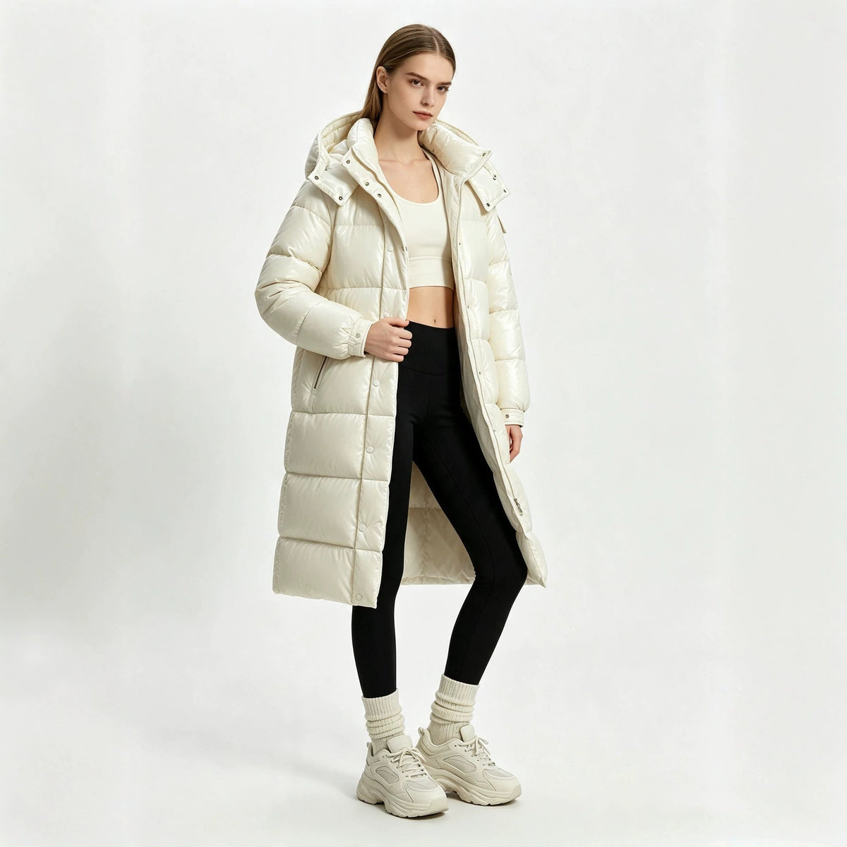White long padded hooded coat with front zipper and quilted puffer panels, over-the-knee
