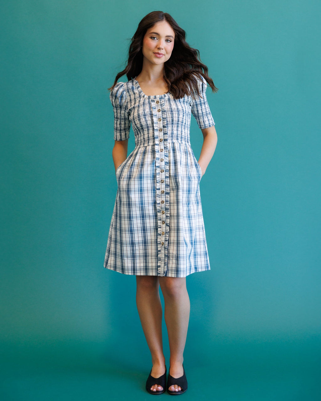 Cream and blue plaid dress with square neckline, button row, short puff sleeves