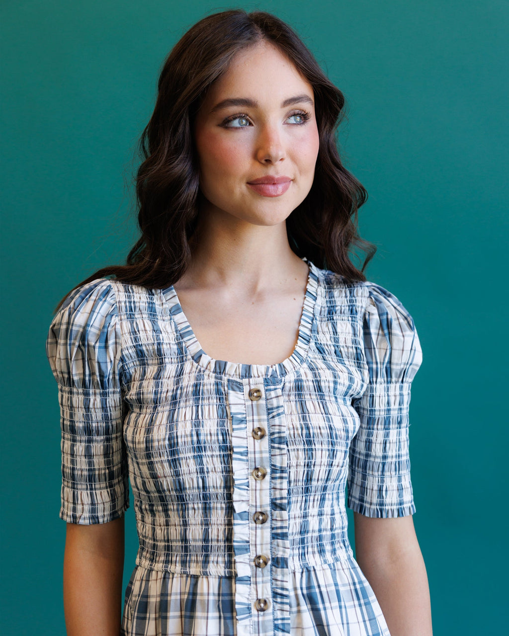 Cream and blue plaid dress close-up: button-front bodice with square neckline