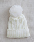 Cream knit beanie with ribbed brim and white pom-pom