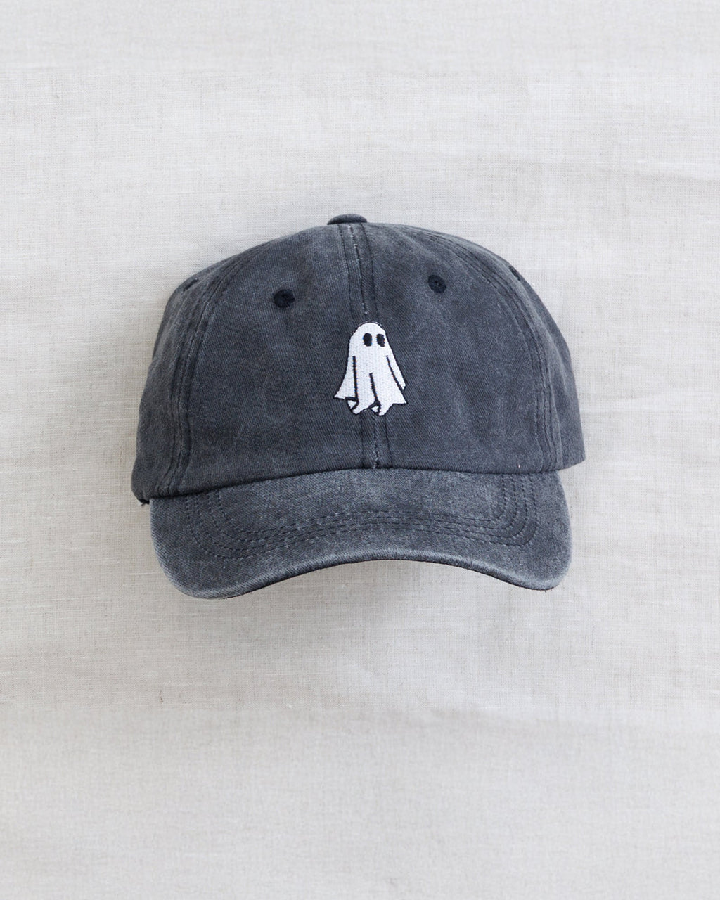 Dark gray baseball cap with centered embroidered ghost on front panel