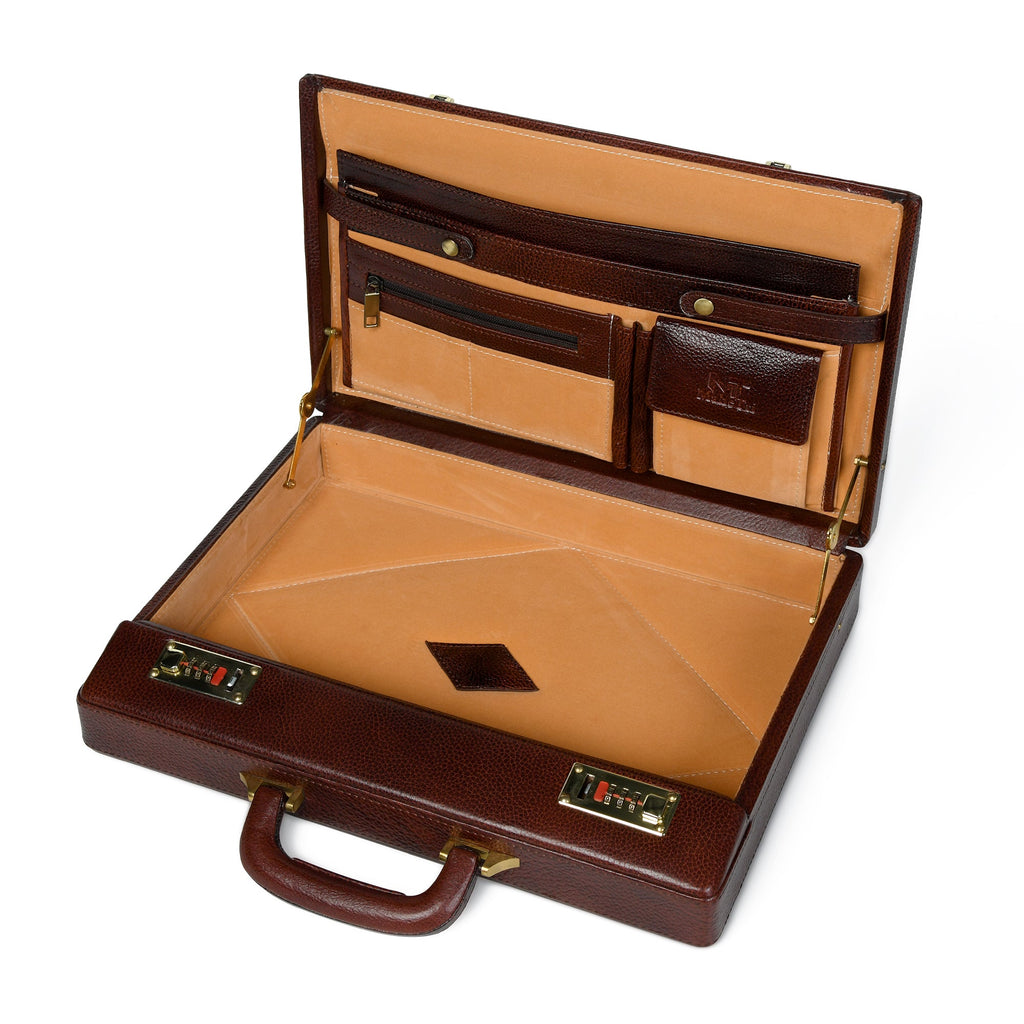 Rich brown leather office suitcase interior with tan document slots and storage tray