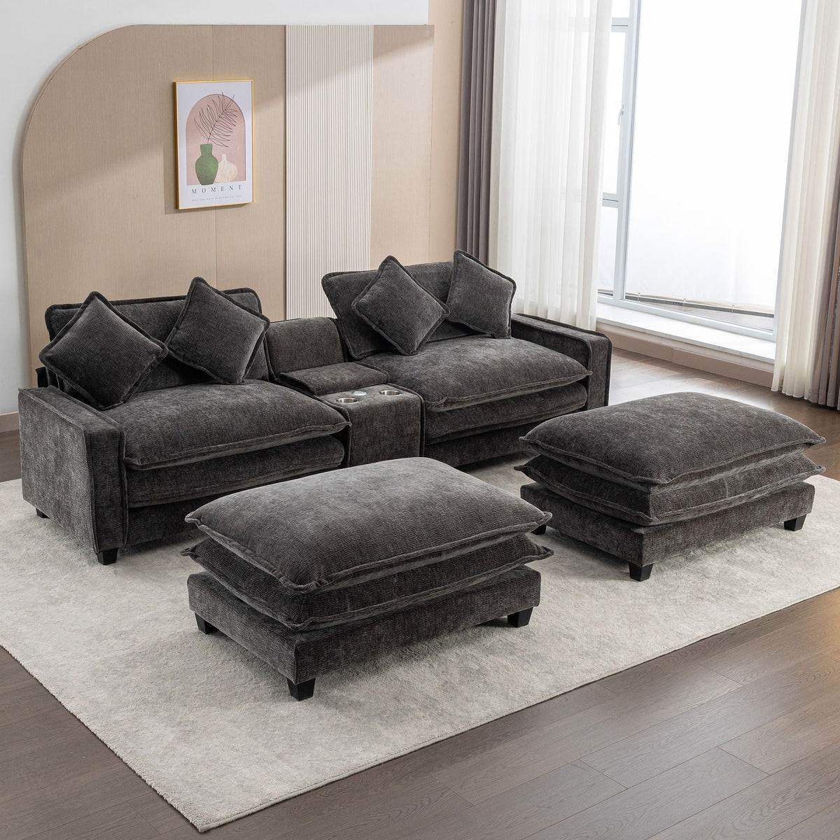 Dark gray sectional sofa with ottomans and four accent pillows