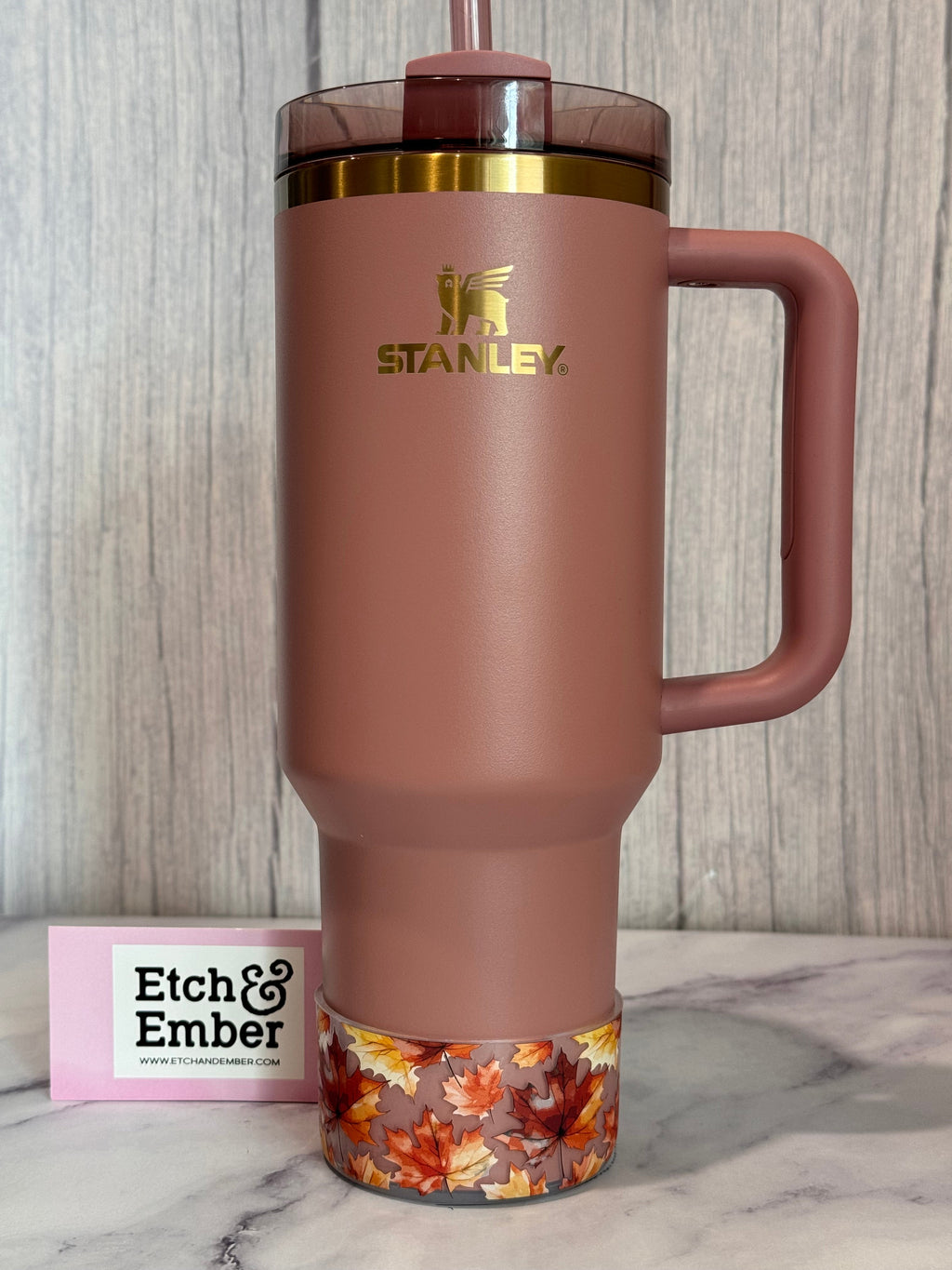 Transparent fall-leaves bottle boot wrap at base, orange and red maple leaf pattern