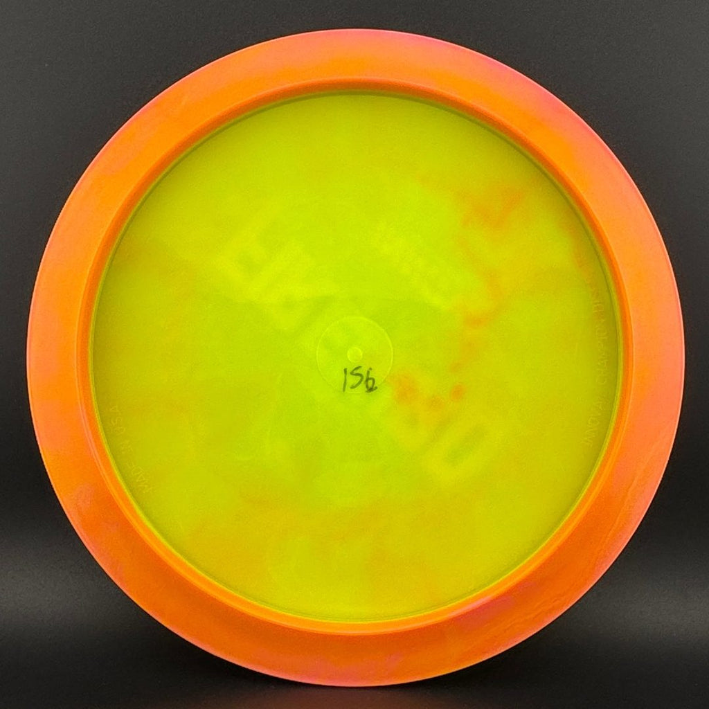 Neon yellow disc golf driver bottom view with small center stamp