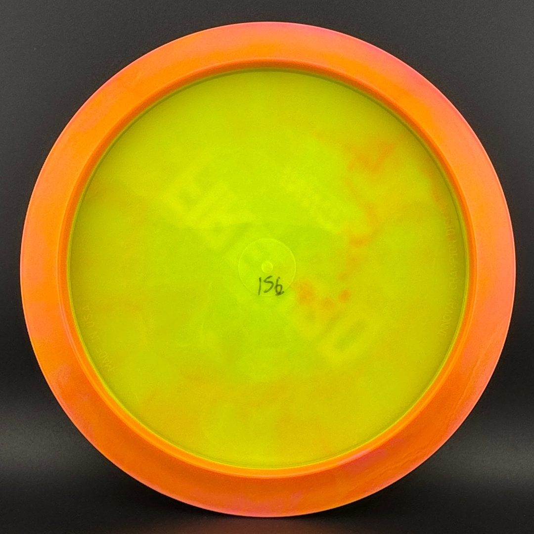 Neon yellow disc golf driver bottom view with small center stamp
