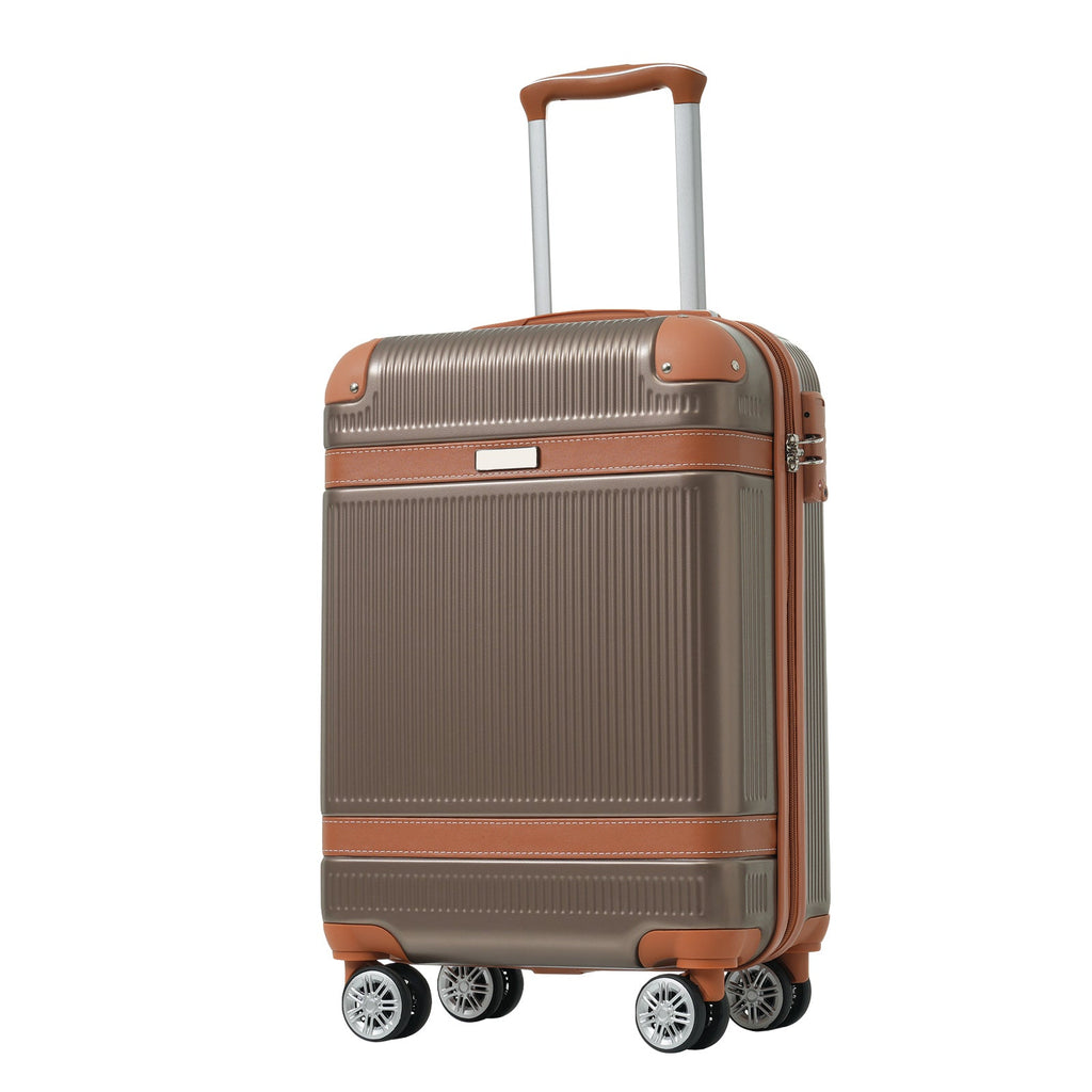 Grey hardshell carry-on suitcase with copper-brown side trim and four spinner wheels