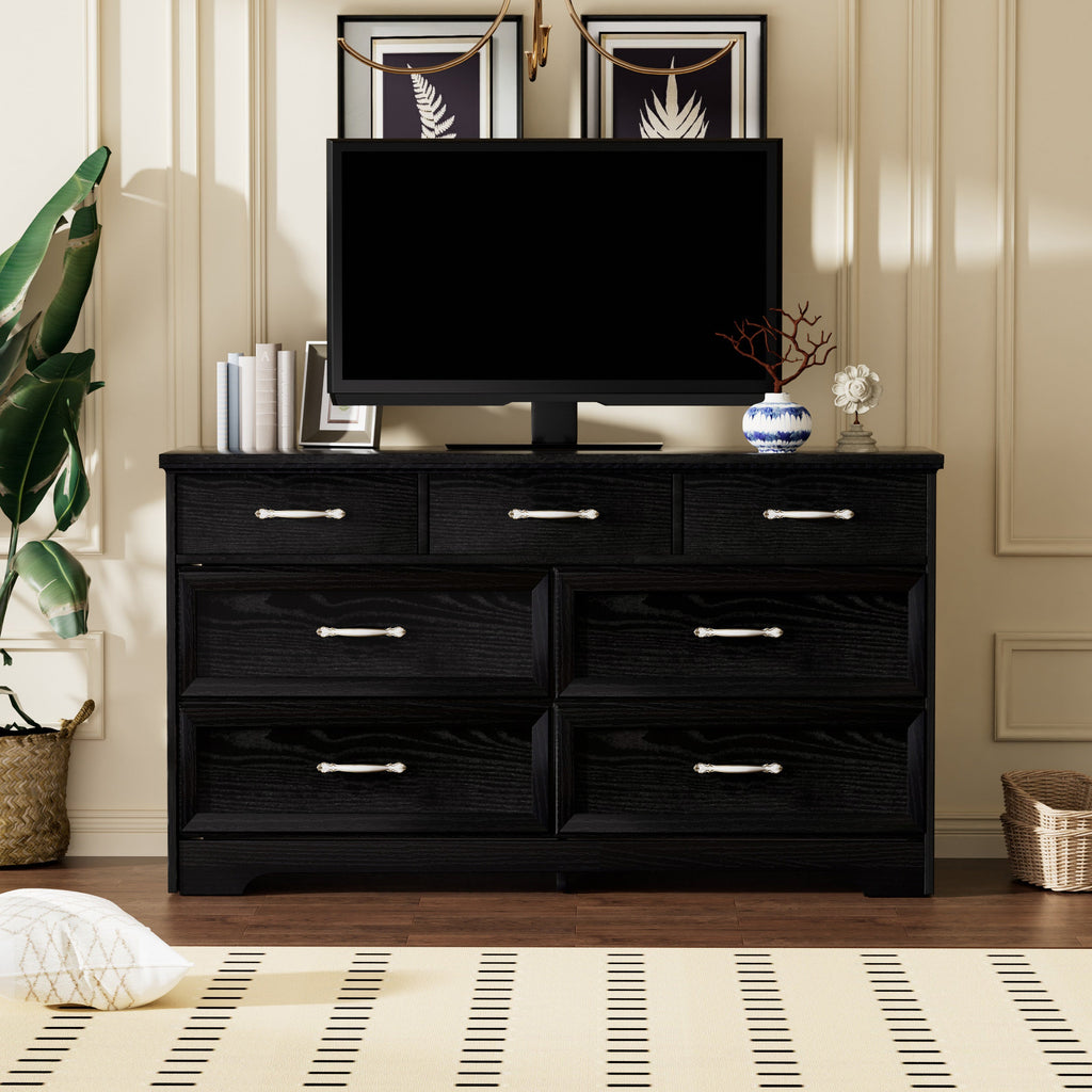 Black multi-drawer dresser with silver metal pulls, centered two-door cabinet section