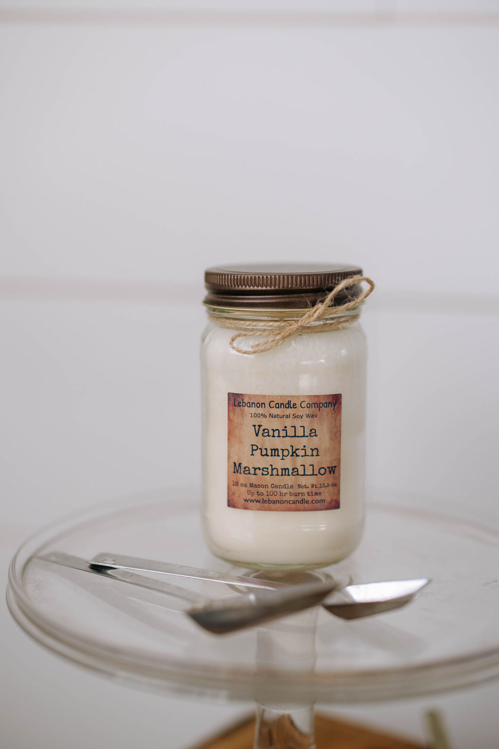 Jar candle with vanilla pumpkin marshmallow label and twine-tied bronze lid