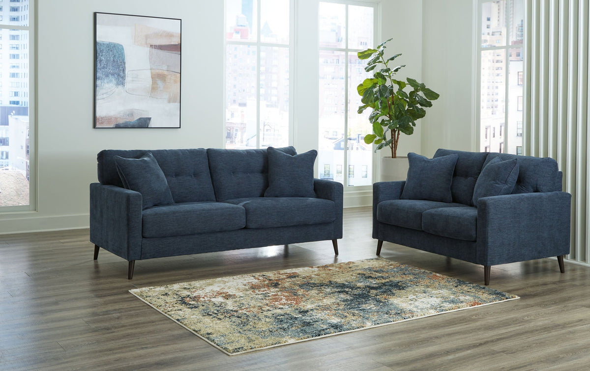 Blue fabric sofa and loveseat set with square arms and tapered legs