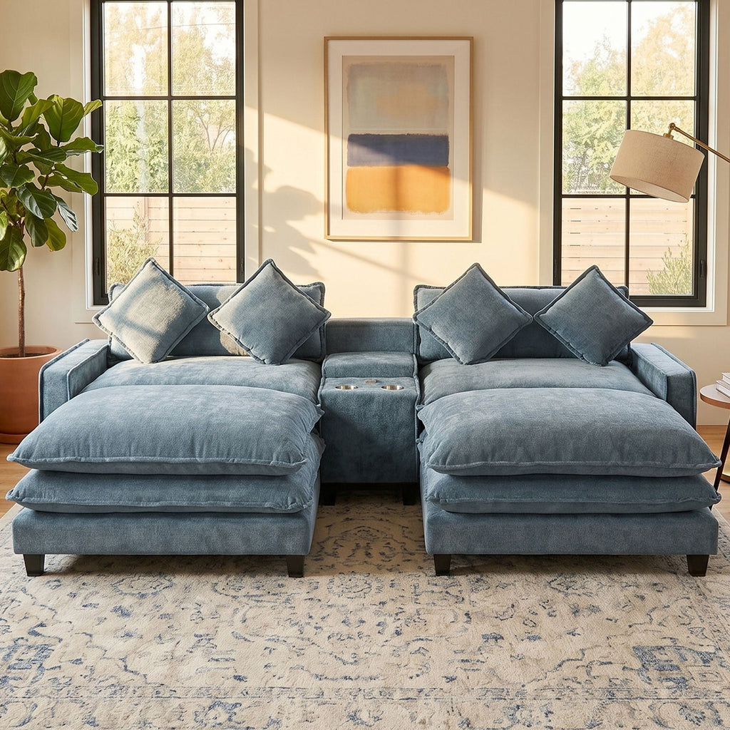 Light blue sectional sofa with removable ottomans and four accent pillows