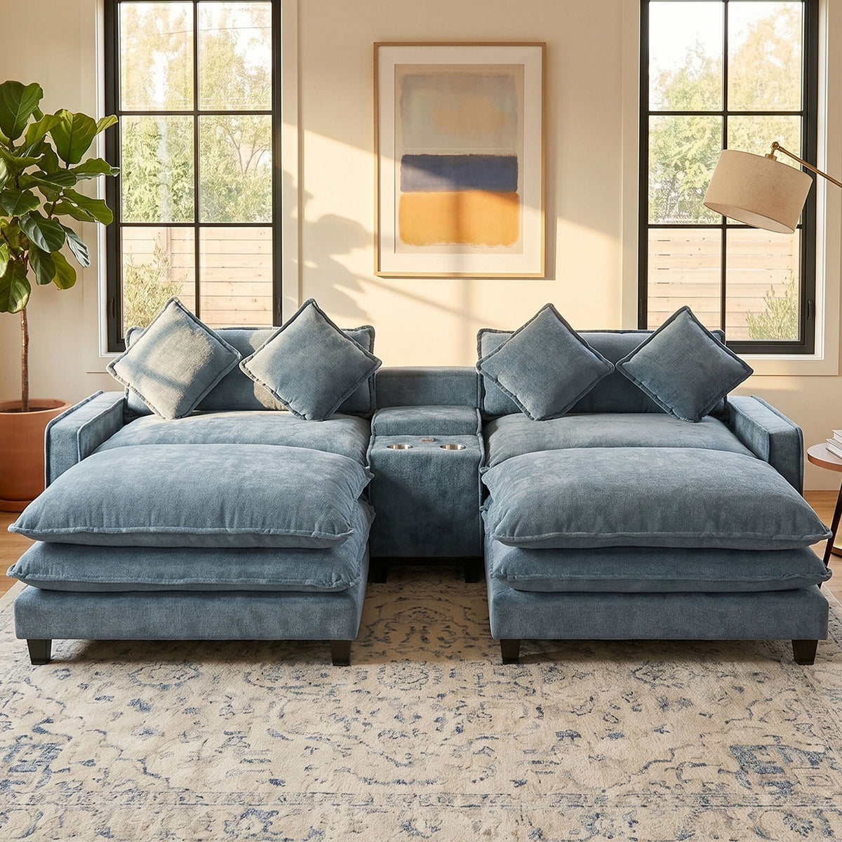 Light blue sectional sofa with removable ottomans and four accent pillows