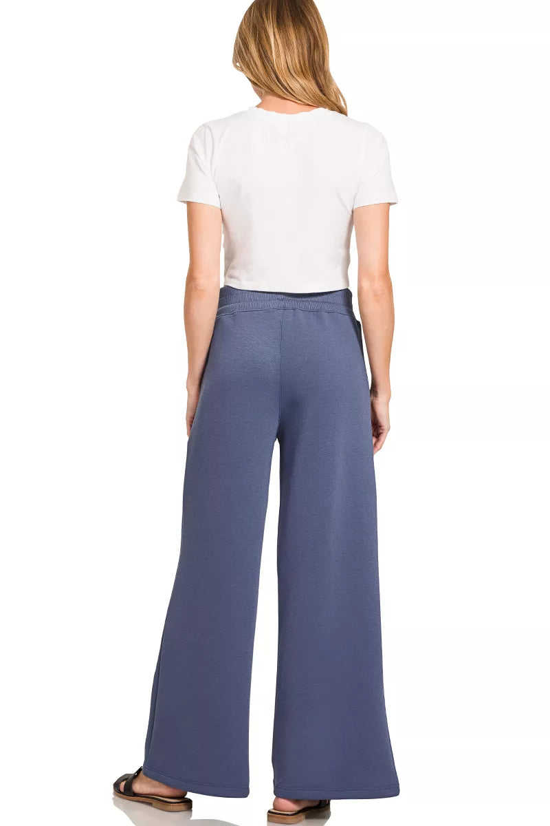 Back view of blue indigo wide-leg pants with elastic waistband
