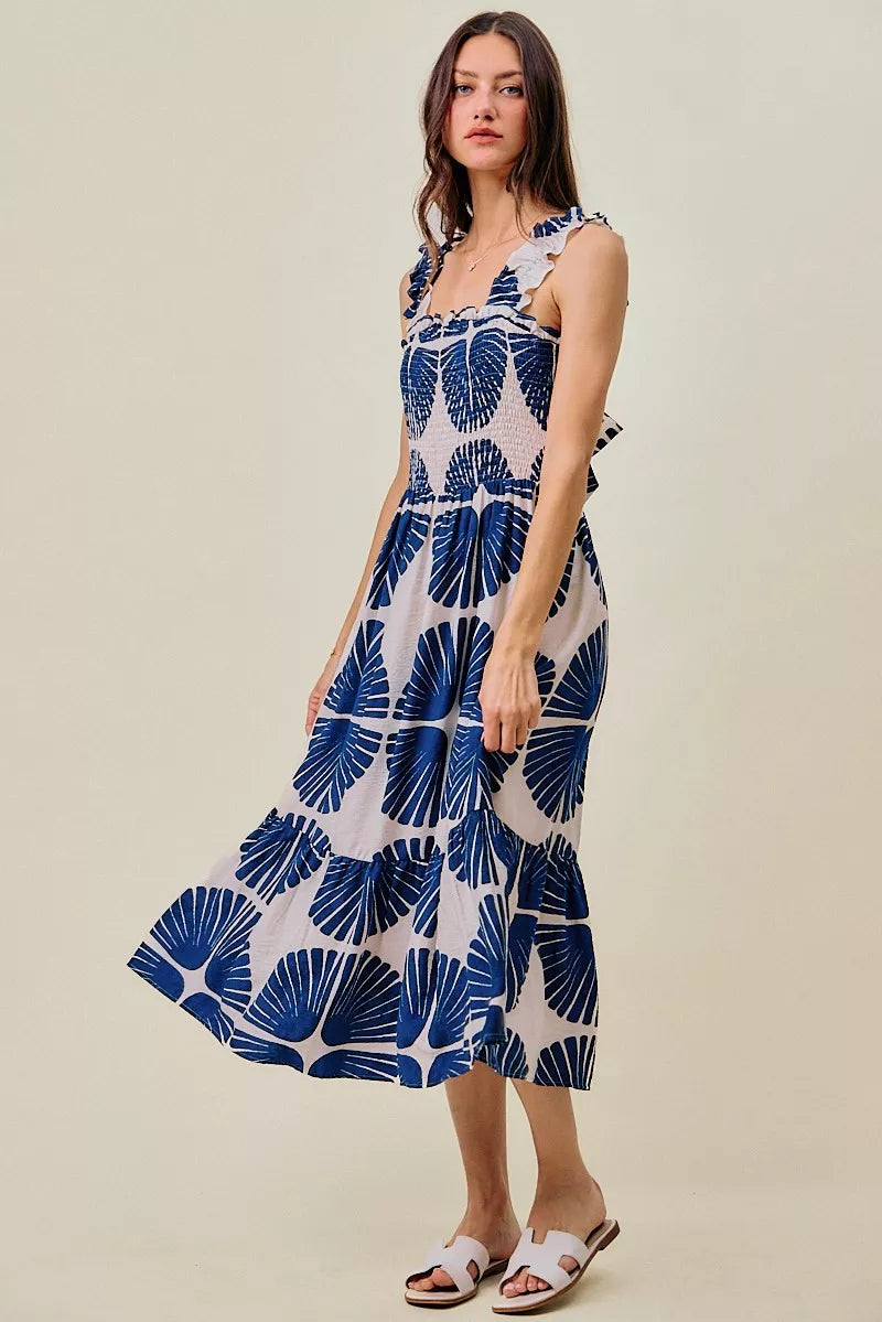 Navy and white abstract print sleeveless tiered midi dress with smocked bodice