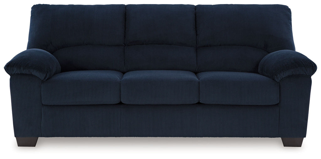 Dark navy sofa with ribbed upholstery and roll arms