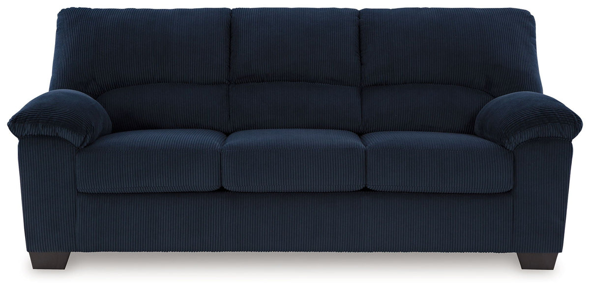 Dark navy sofa with ribbed upholstery and roll arms