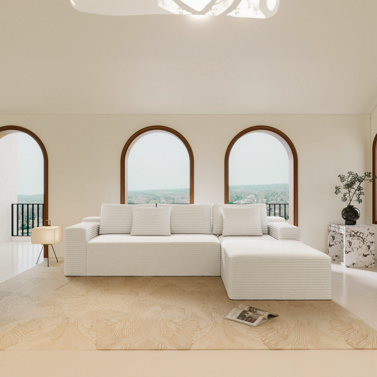 White modular sectional sofa seat with corner chaise and padded armrests, plush cushions