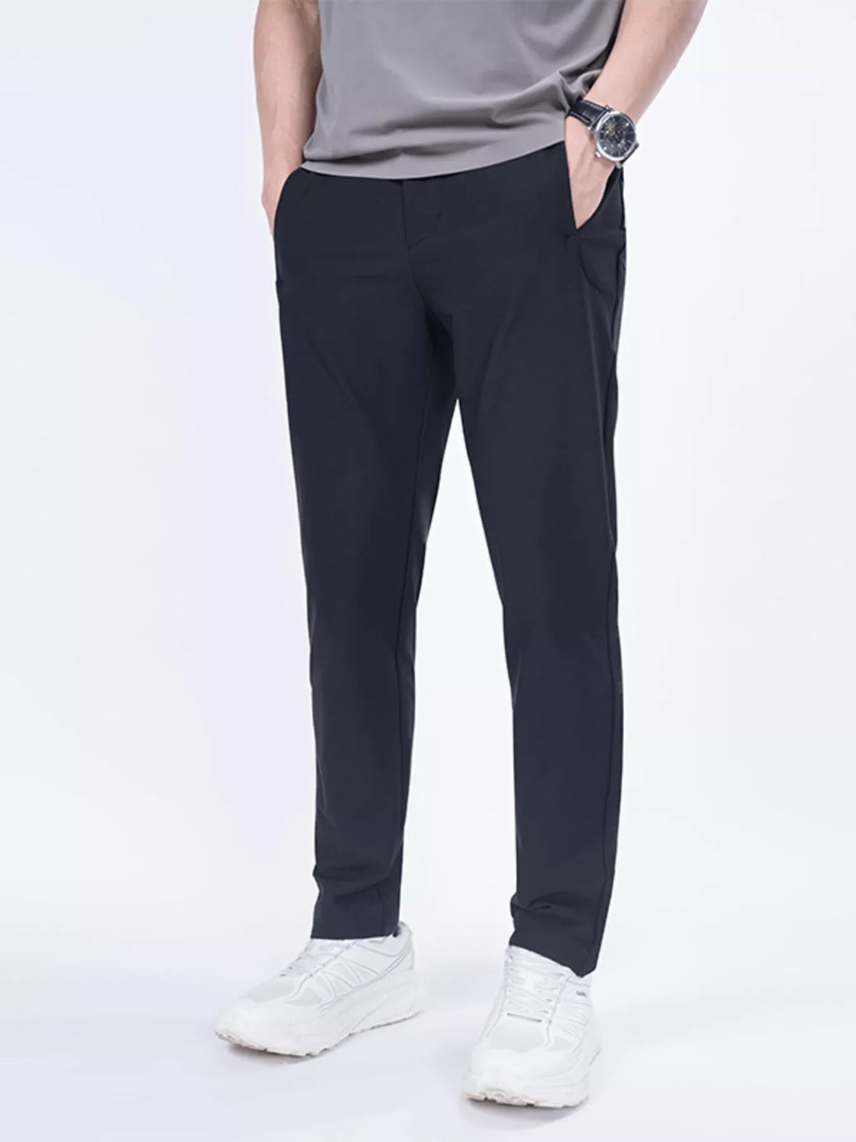 Men's slim-fit casual pants in black, tapered legs with belt loops and side pockets