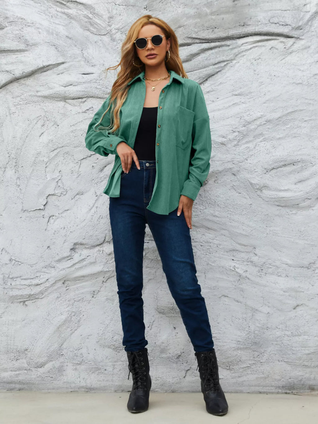 Teal-green corduroy button-up shirt with button front and a chest pocket