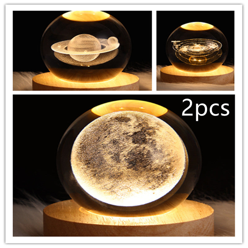 LED galaxy crystal ball lamp with moon-like textured glow on wooden base